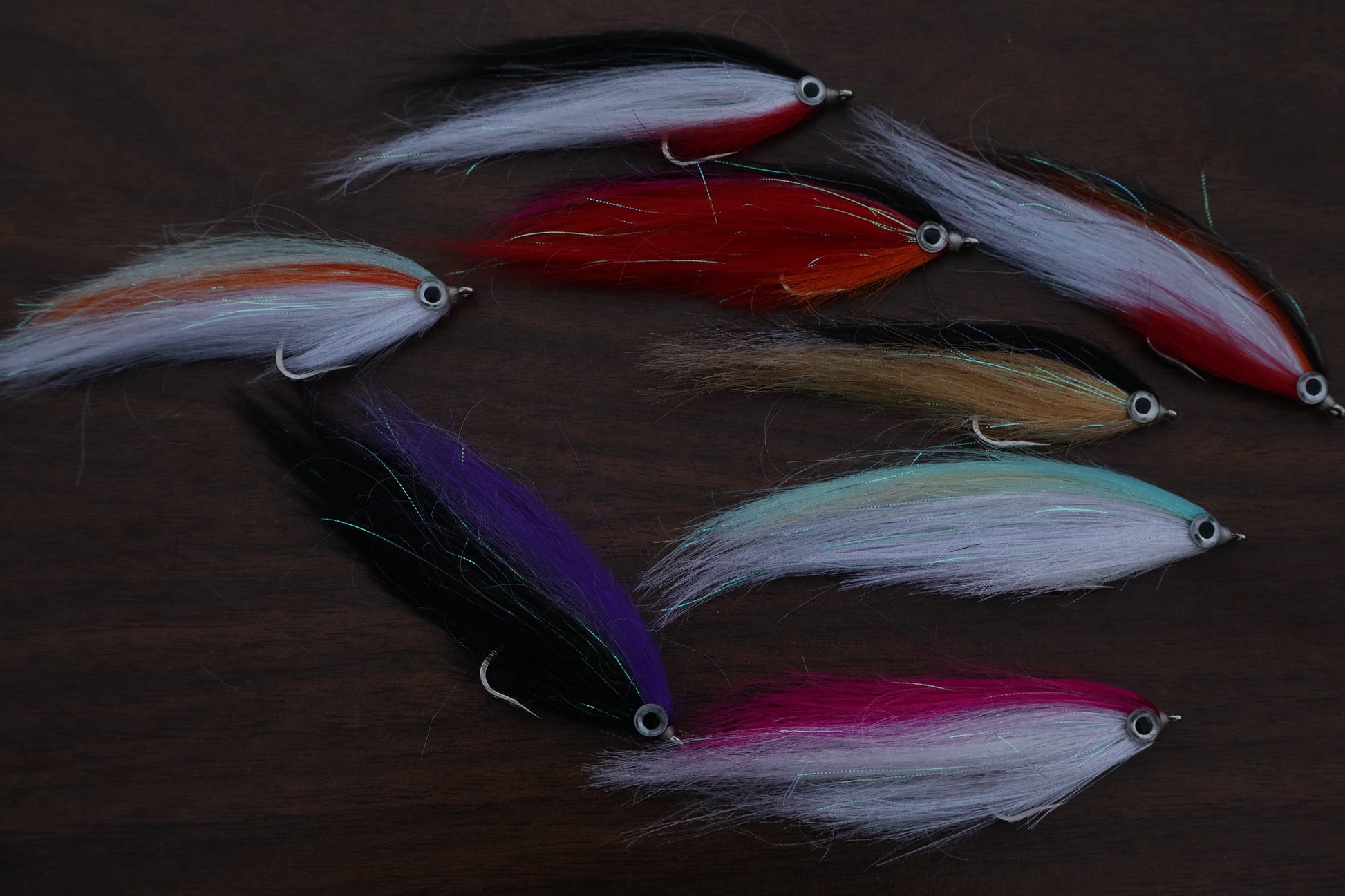 Collection of colorful fishing lures on a dark background
