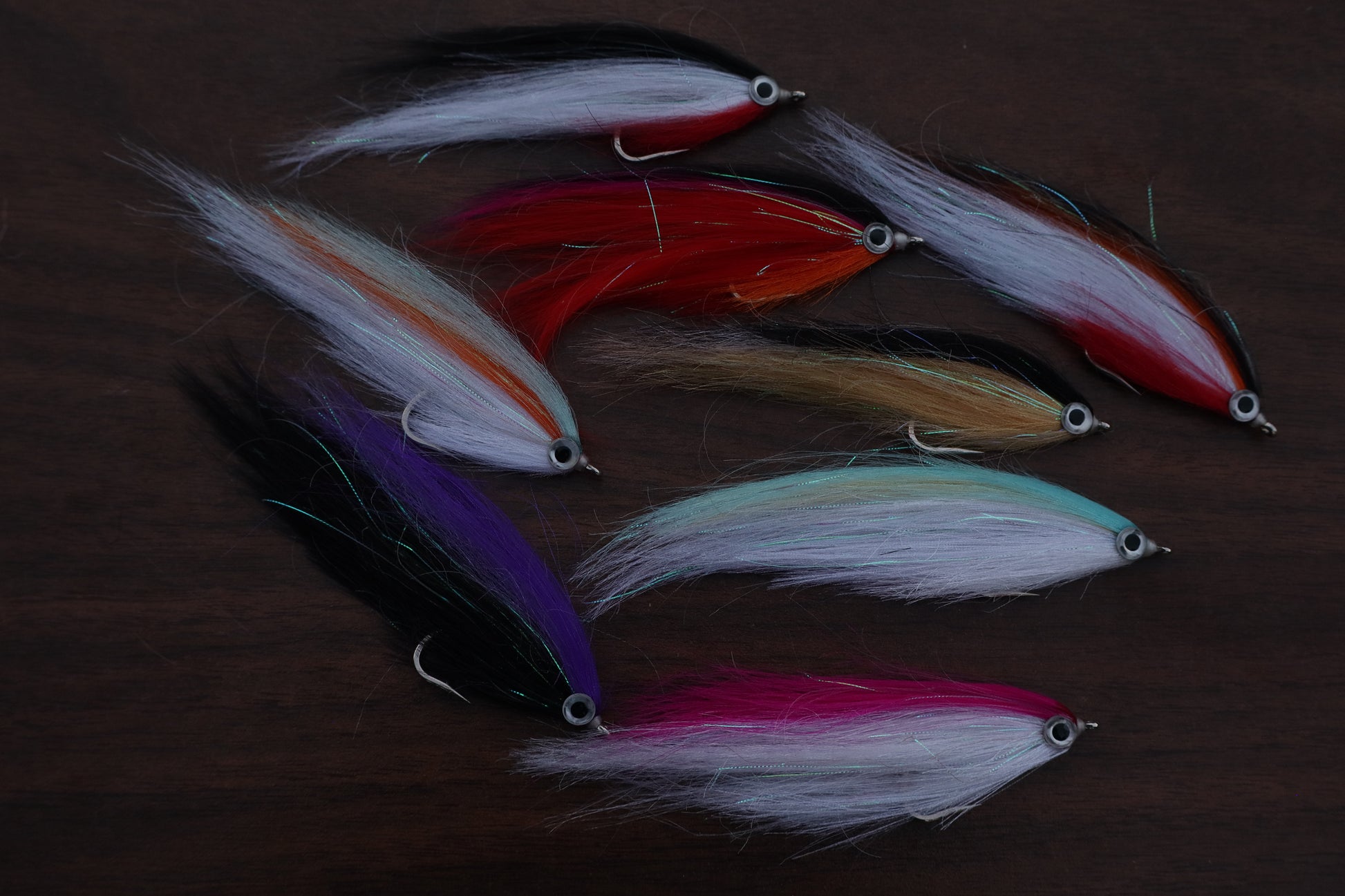 Set of colorful fishing lures on a dark background