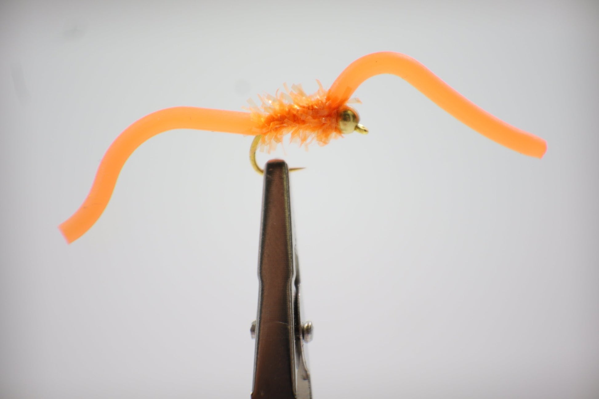 Squirmy Wormy Fly close up orange