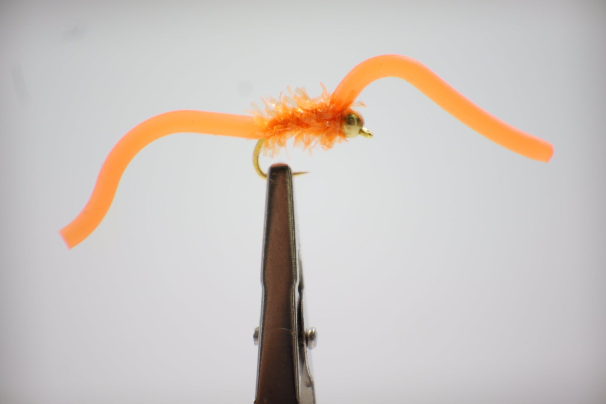 Squirmy Wormy Fly close up orange